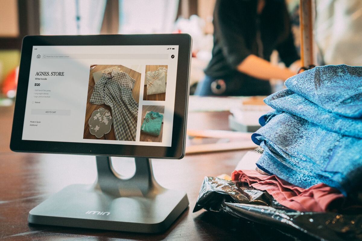 Small shop owner using a tablet point-of-sale system