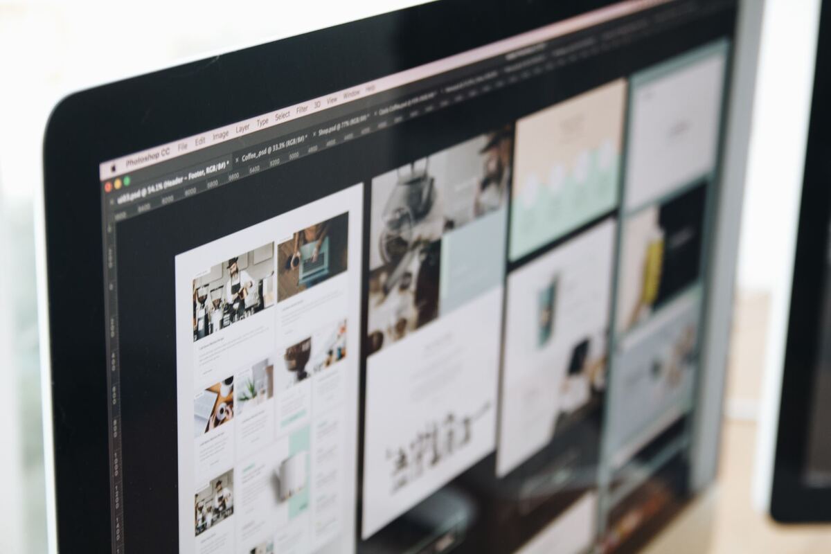 Web designer reviewing website layouts